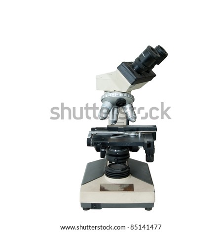 An old-fashioned microscope isolated over white