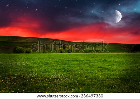 Green field in the night. Elements of this image furnished by NASA.