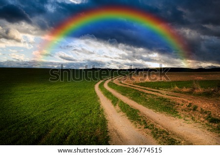 Dirt road and rainbow in the night.