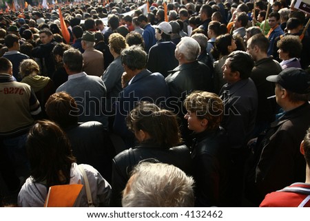 Many people at a meeting in the street seen from above