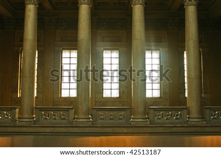 Museum interior with windows light and marble columns.