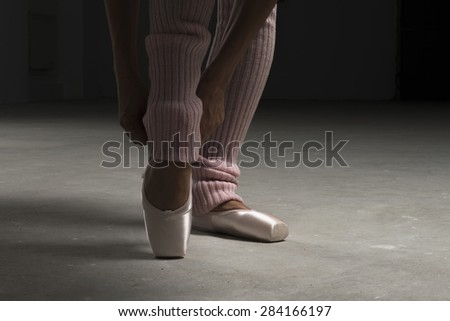 ballerina legs with ballet shoes and warmers