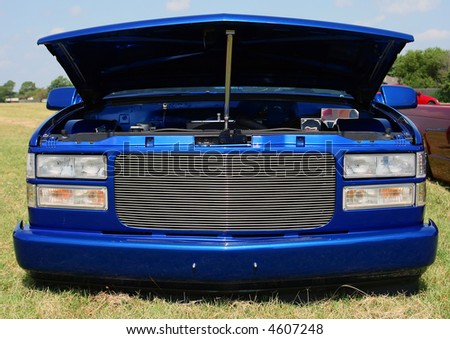 stock photo Front Shot of a Blue Lowrider Truck