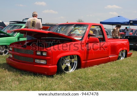 stock photo Red 90s model lowrider Chevrolet truck