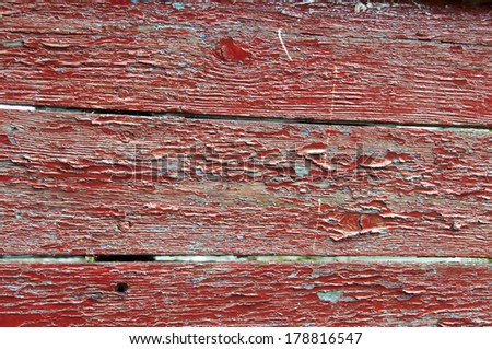 A close up view of the paint on a wooden boat