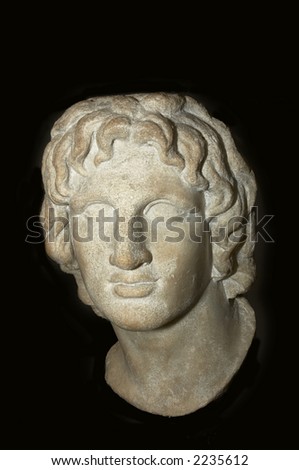 a greek statue of a head isolated on black