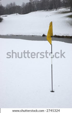 A golf green after a snow fall