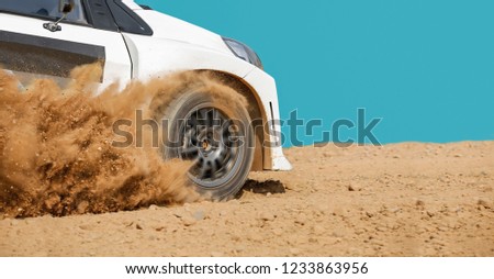 Rally racing car in dirt track.
