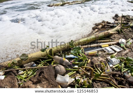 Water pollution - old garbage and pollution in river