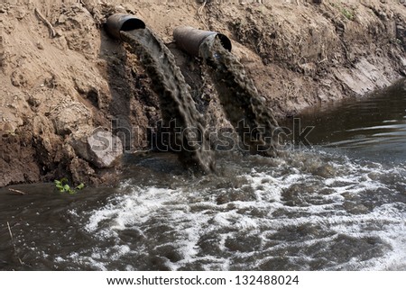 Water pollution in river because industrial not treat water before drain.