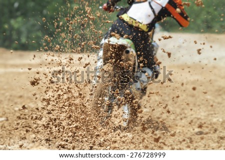 Mud debris flying from a motocross race