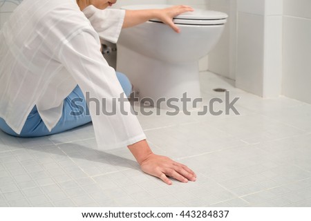Retirement woman fell down in a restroom