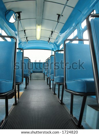 A view down the aisle of a restored 1959 city transit bus. Very much like the bus Rosa Parks made her stand in.
