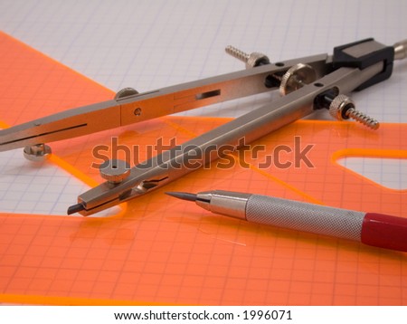 Professional drafting tools on an engineering grid background