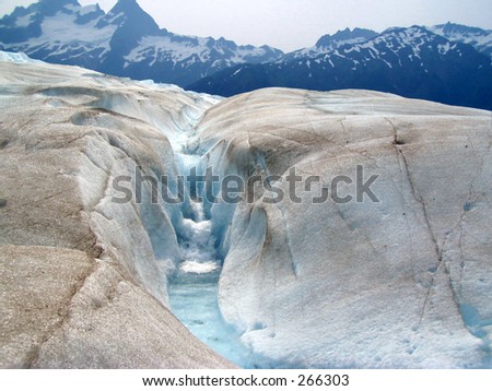 A glacial stream and waterfall on Mendenhall Glacier in Juneau, Alaska,