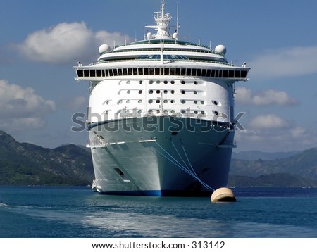 Cruise ship anchored in Caribbean port.