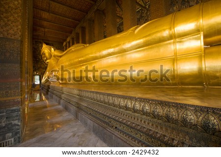The reclining Buddha at Wat Pho in Bangkok, Thailand.  Largest reclining Buddha in the world.