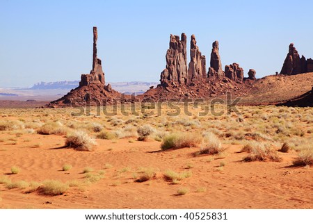 The Totem Pole and Yei Bi Chei rock formations in Monument Valley.