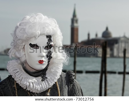 VENICE - MARCH 5: An unidentified person in costume in St. Mark\'s Square during the Carnival of Venice on March 5, 2011 in Venice, Italy. The 2011 annual carnival is held February 26 to March 8, 2011