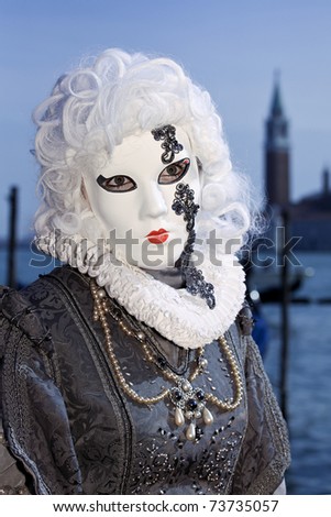 VENICE - MARCH 5: An unidentified person in costume in St. Mark's Square during the Carnival of Venice on March 5, 2011.  The 2011 carnival was held from February 26th to March 8th.