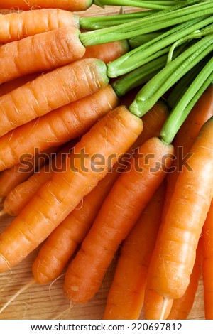 fresh carrots bunch on wood
