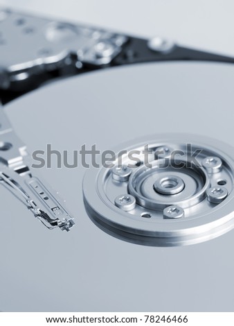 Close up of open hard disk drive, cylinders and heads