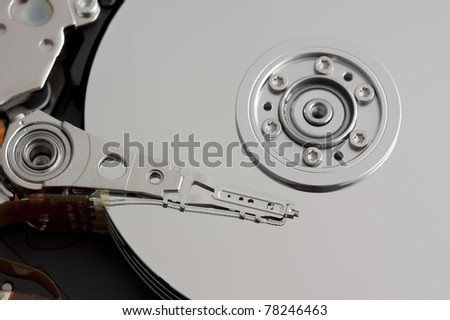 Close up of open hard disk drive, cylinders and heads