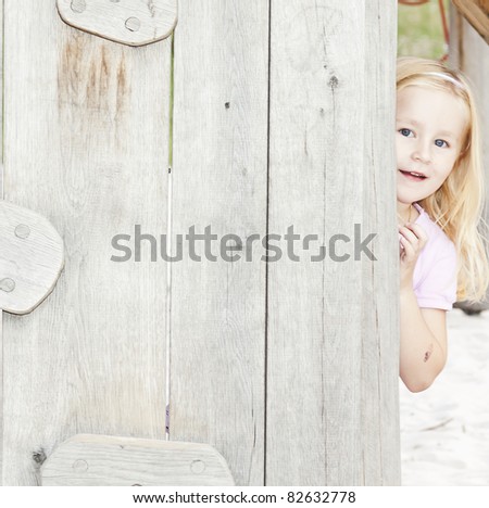 little child behind wooden board.\
See my portfolio for more