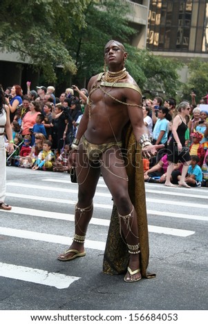 ATLANTA - AUGUST 31: Someone dressed as Xerxes from the \'300\' poses in the middle of the annual DragonCon parade held on August 31, 2013 in Atlanta.