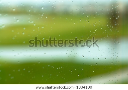 Golf course in the rain. This image has less rain drops but more blurred background.  Can also be a nice background image. This is a photo from A Raining Day Collection. Search keyword Series005.
