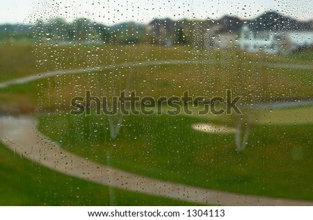 Golf course in the rain. This image has more rain drops but more clear background view. Can also be a nice background image. This is a photo from A Raining Day Collection. Search keyword Series005