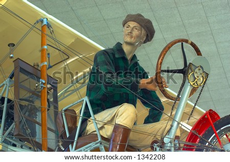 A pilot of a vintage biplane. More with keyword Series007.