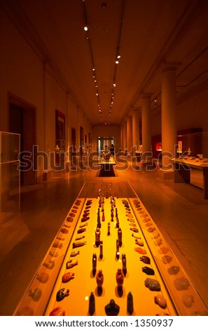 Museum-like setting with columns, spot lights & displays. More with keyword Series003.