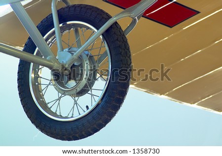 The rear wheel of a vintage biplane More with keyword Series007.