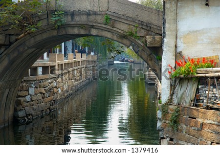 Bridge arch and traditional Chinese houses on a river. More with keyword Series11A.