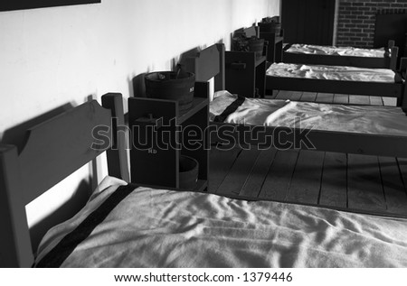 B&W. A row of beds in soldiers\' quarter in 1820s. More with keyword Series08B.