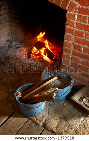 Buckets next to the fireplace in kitchen at Fort Snelling in 1820s. More with keyword Series08E.