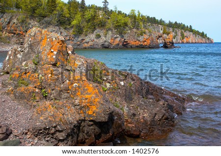 Golden rock formation and rock arch on Lake Superior North Shore. More with keyword Series14.