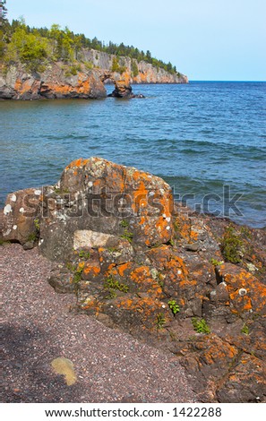 Golden rock formation and rock arch on Lake Superior North Shore. More with keyword Series14.
