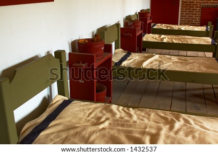 A row of beds in soldiers\' quarter in 1820s. More with keyword Series08B.