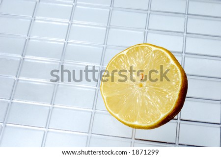 half lemon in square background