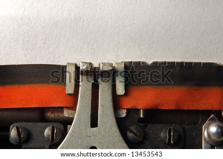 macro shoot of typewriter with blank page for copy text