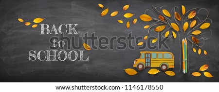 Back to school concept. Top view banner school bus and pencils next to tree sketch with autumn dry leaves over classroom blackboard background