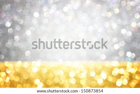 silver and gold defocused lights  background. abstract bokeh lights