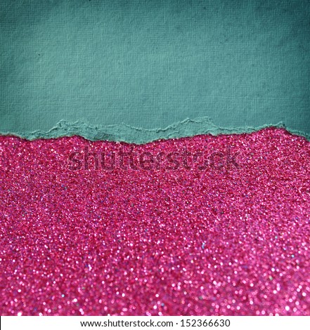 pink glitter background and blue vintage torn paper . room for copy space.