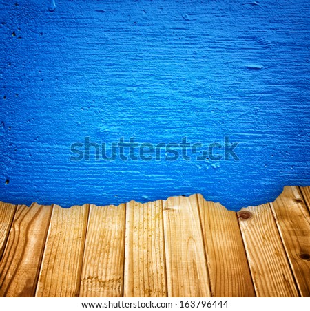 blue painted wall and broken wood planks effect