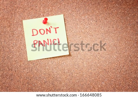 cork board with pinned yellow note and the phrase \