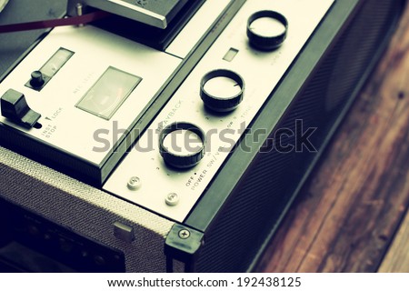 close up of old reel to reel recorder. vintage filtered image