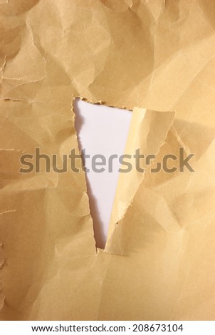 brown torn paper with hole with hole for design