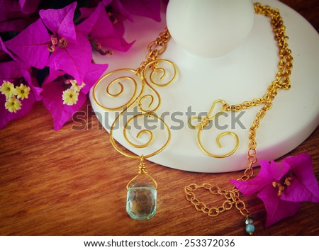 antique vintage necklace on wooden table. retro filtered image